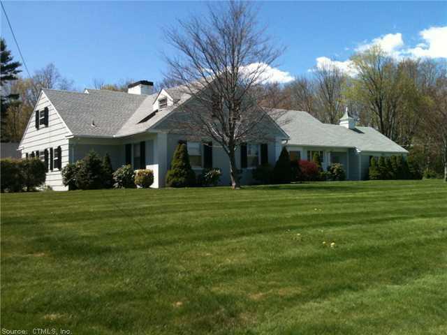 70 Vaill Road Watertown, CT 06795 - Photo 1 of 1 a big yard with table and chairs under an umbrella