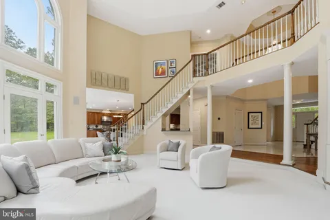 a spacious bedroom with a bed and a cabinets