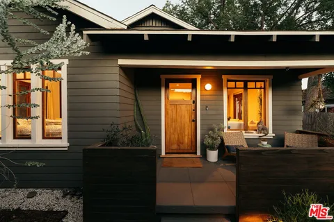 a front view of a house with a porch