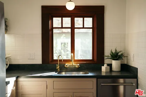 a kitchen with a sink and cabinets