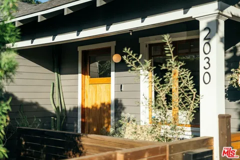 a front view of a house with a glass door