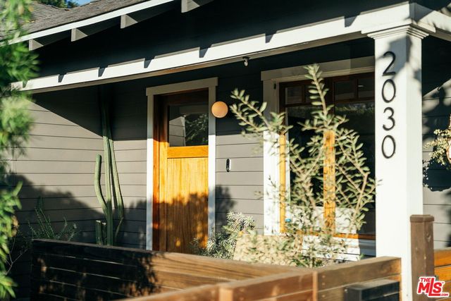 a front view of a house with a glass door
