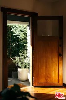 a front view of house with outdoor seating and plants