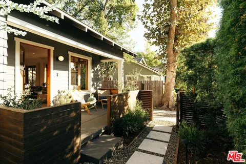 a view of a backyard with sitting area