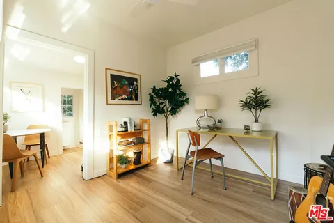 a kitchen with a table and chairs in it