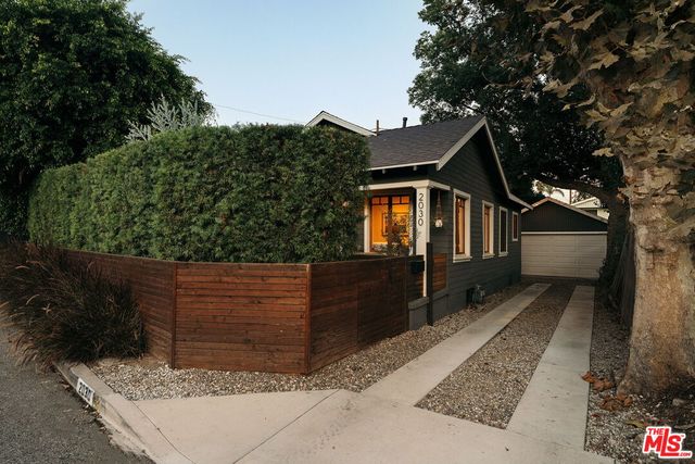 a backyard of a house with seating space