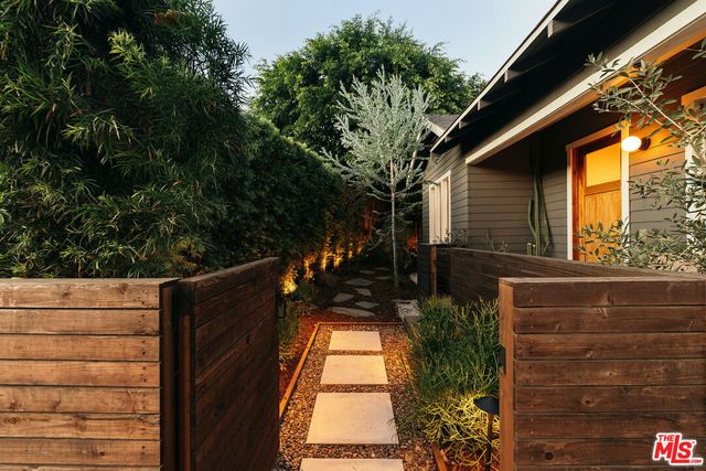 a backyard of a house with outdoor seating