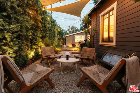 a view of house with yard and green space