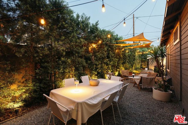 an aerial view of a house with a yard and garden