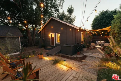 an aerial view of a house with a yard and garden