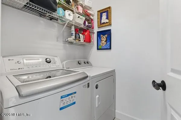 a utility room with dryer and washer