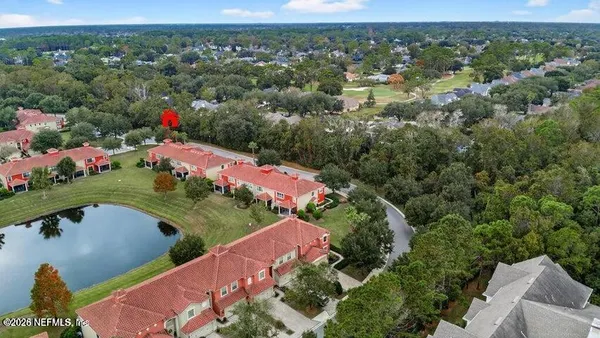 an aerial view of a house with a garden