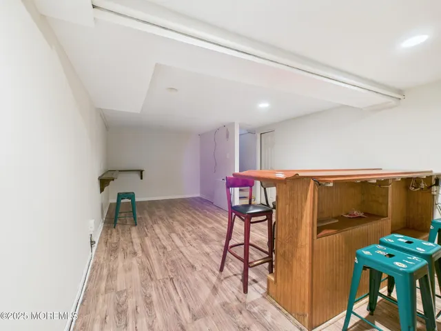 a balcony with table and chairs