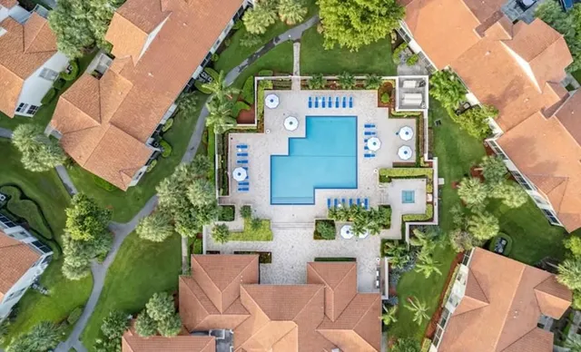 an aerial view of a house with outdoor space and street view