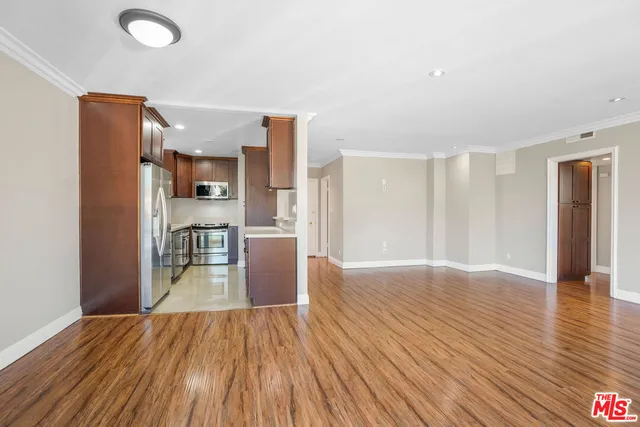 a view of kitchen with furniture and wooden floor