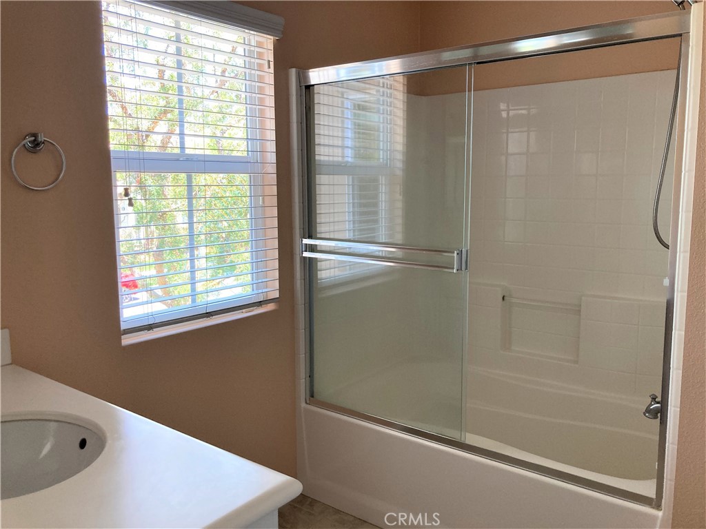 26 Opus Irvine, CA 92618 - Photo 15 of 32 a bathroom with a bathtub and a shower