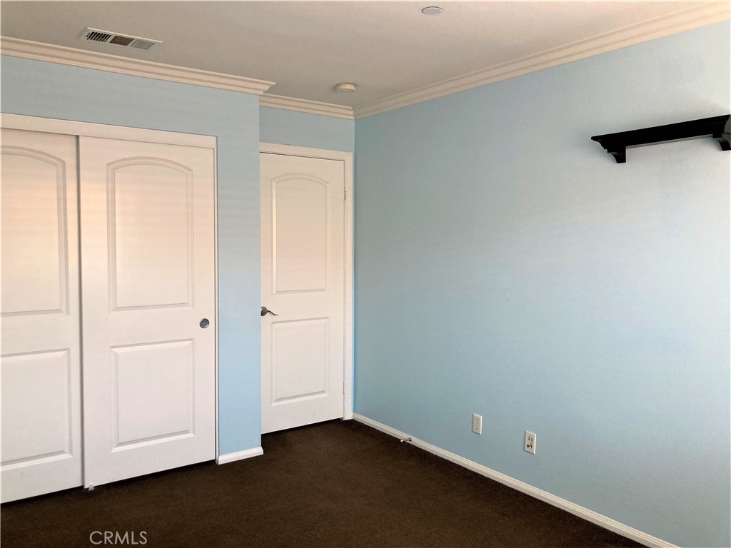 26 Opus Irvine, CA 92618 - Photo 17 of 32 an empty room with closet