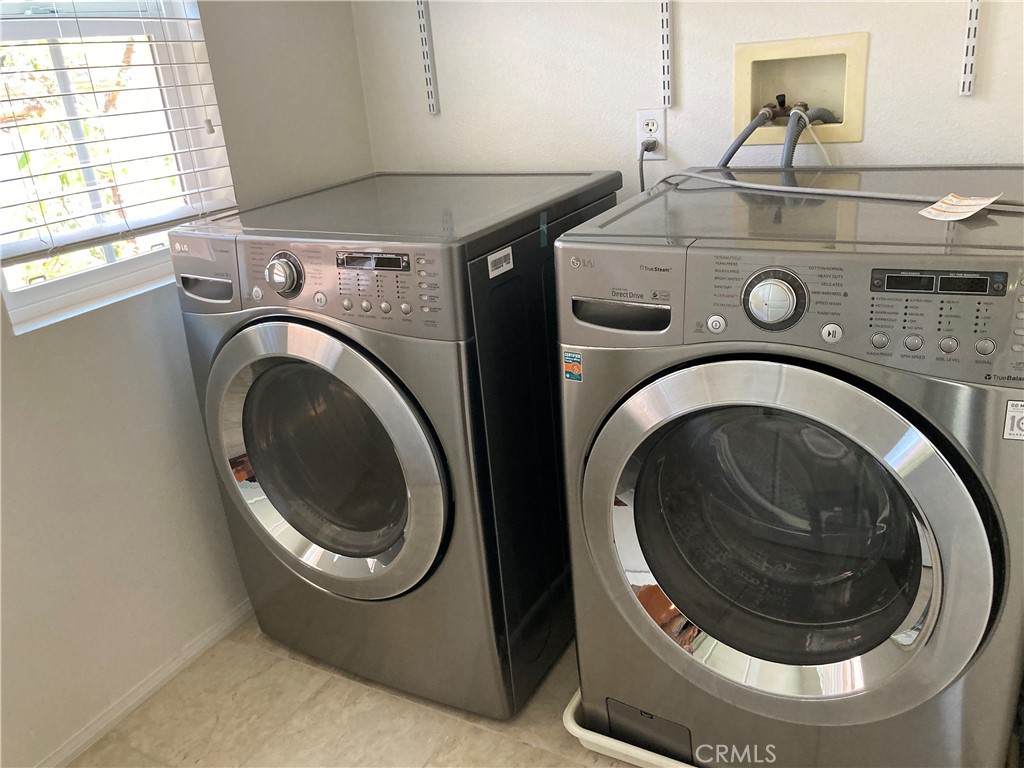 26 Opus Irvine, CA 92618 - Photo 23 of 32 a utility room with dryer and washer