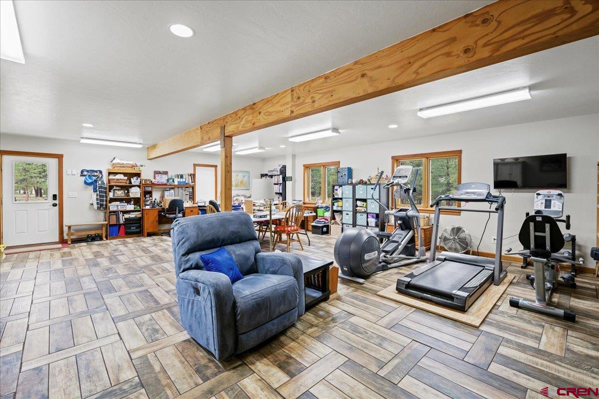 66 Blue Stem Ridgway, CO 81432 - Photo 11 of 19 a living room with furniture and a flat screen tv