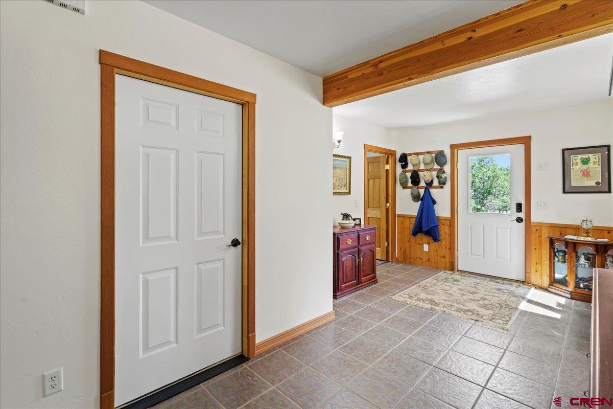 66 Blue Stem Ridgway, CO 81432 - Photo 16 of 19 a view of a livingroom with wooden floor and a cabinet