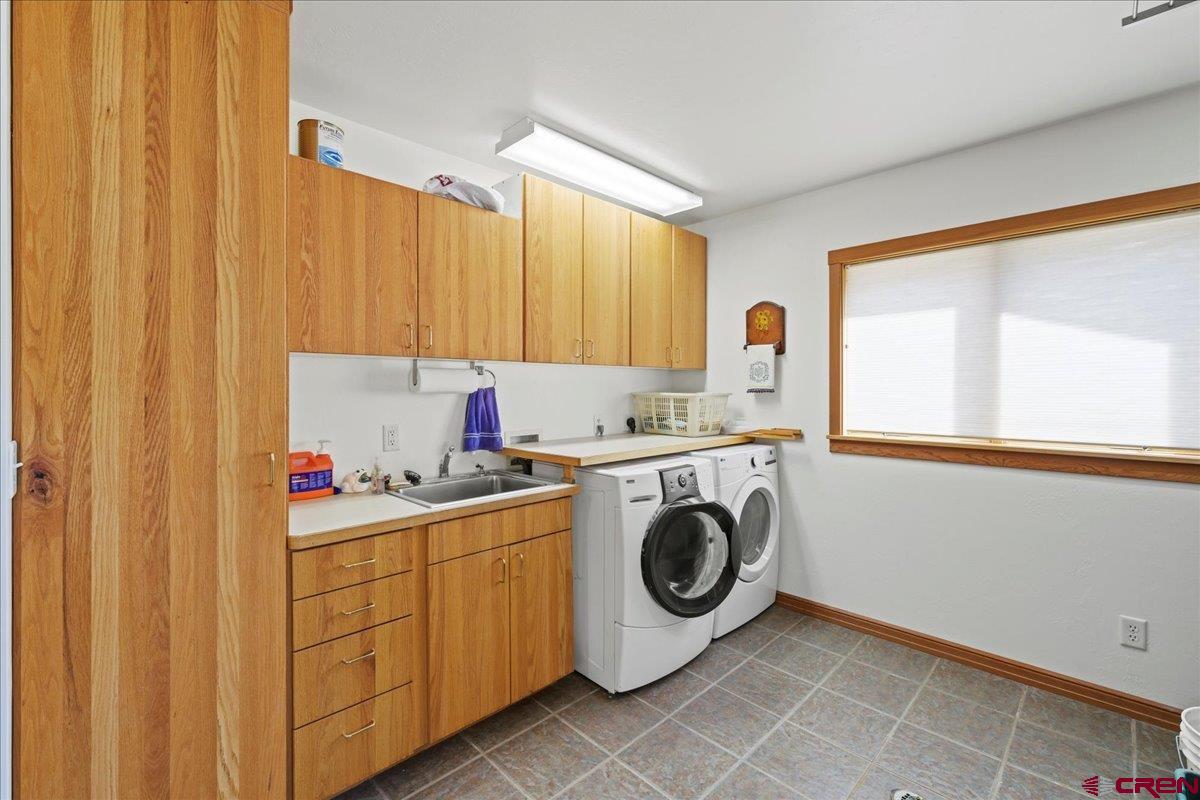 66 Blue Stem Ridgway, CO 81432 - Photo 17 of 19 a utility room with dryer and washer