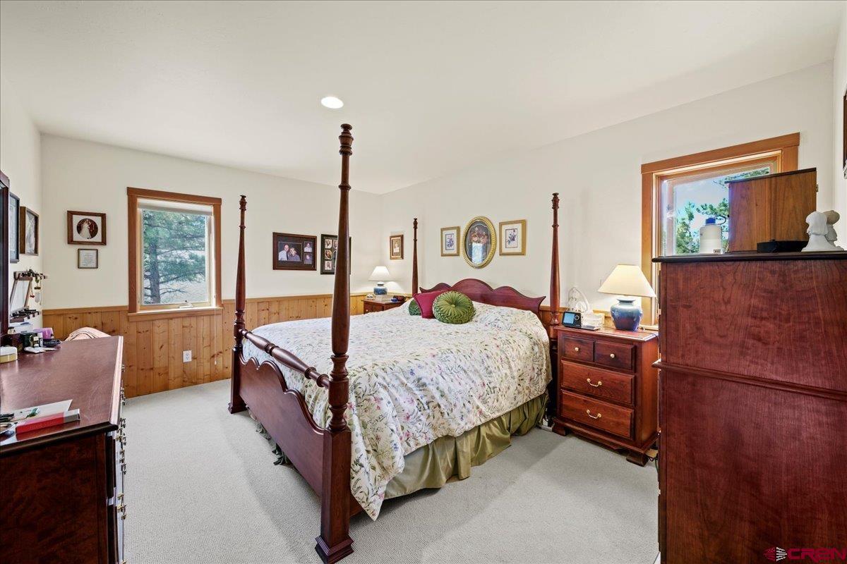 66 Blue Stem Ridgway, CO 81432 - Photo 7 of 19 a bedroom with a bed and a dresser