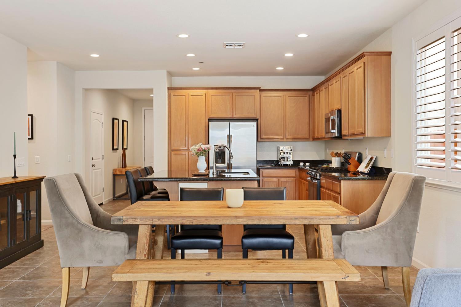 3828 Lookout Drive Modesto, CA 95355 - Photo 11 of 39 a view of a dining room with furniture