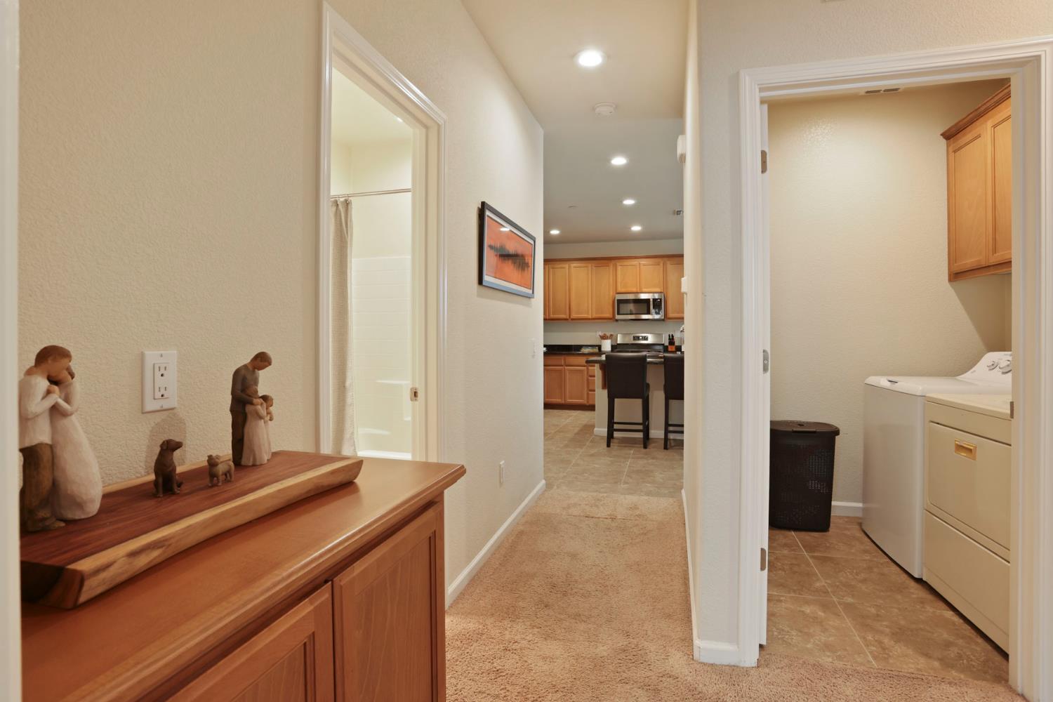 3828 Lookout Drive Modesto, CA 95355 - Photo 14 of 39 a kitchen with refrigerator and cabinets