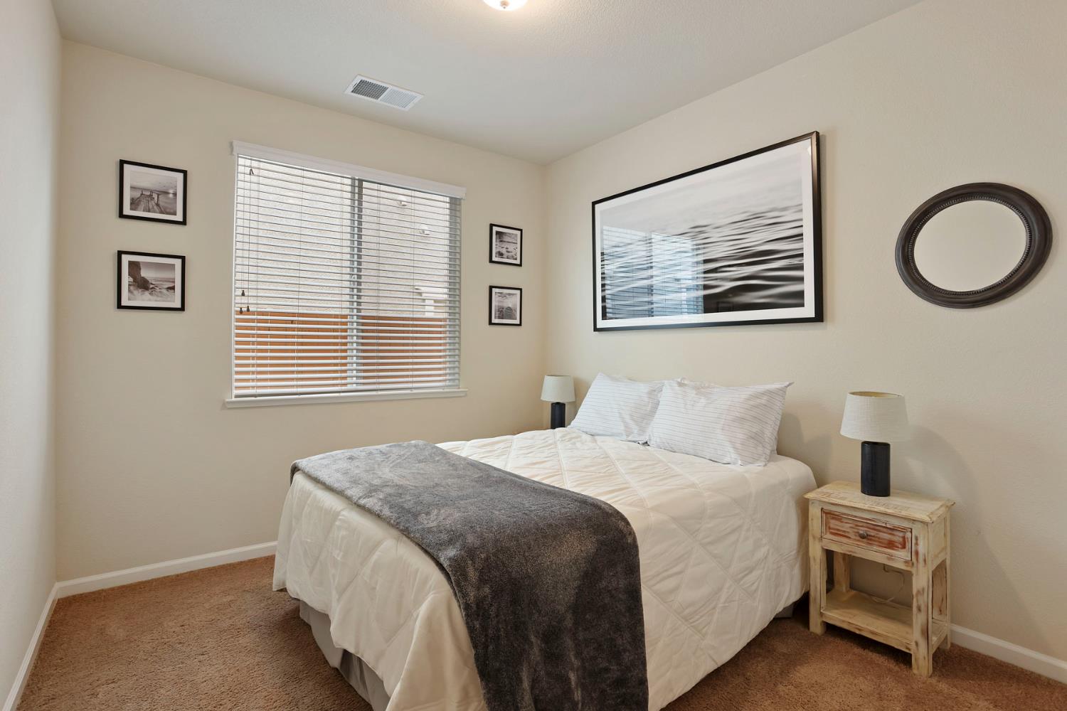 3828 Lookout Drive Modesto, CA 95355 - Photo 16 of 39 a bedroom with bed and a window