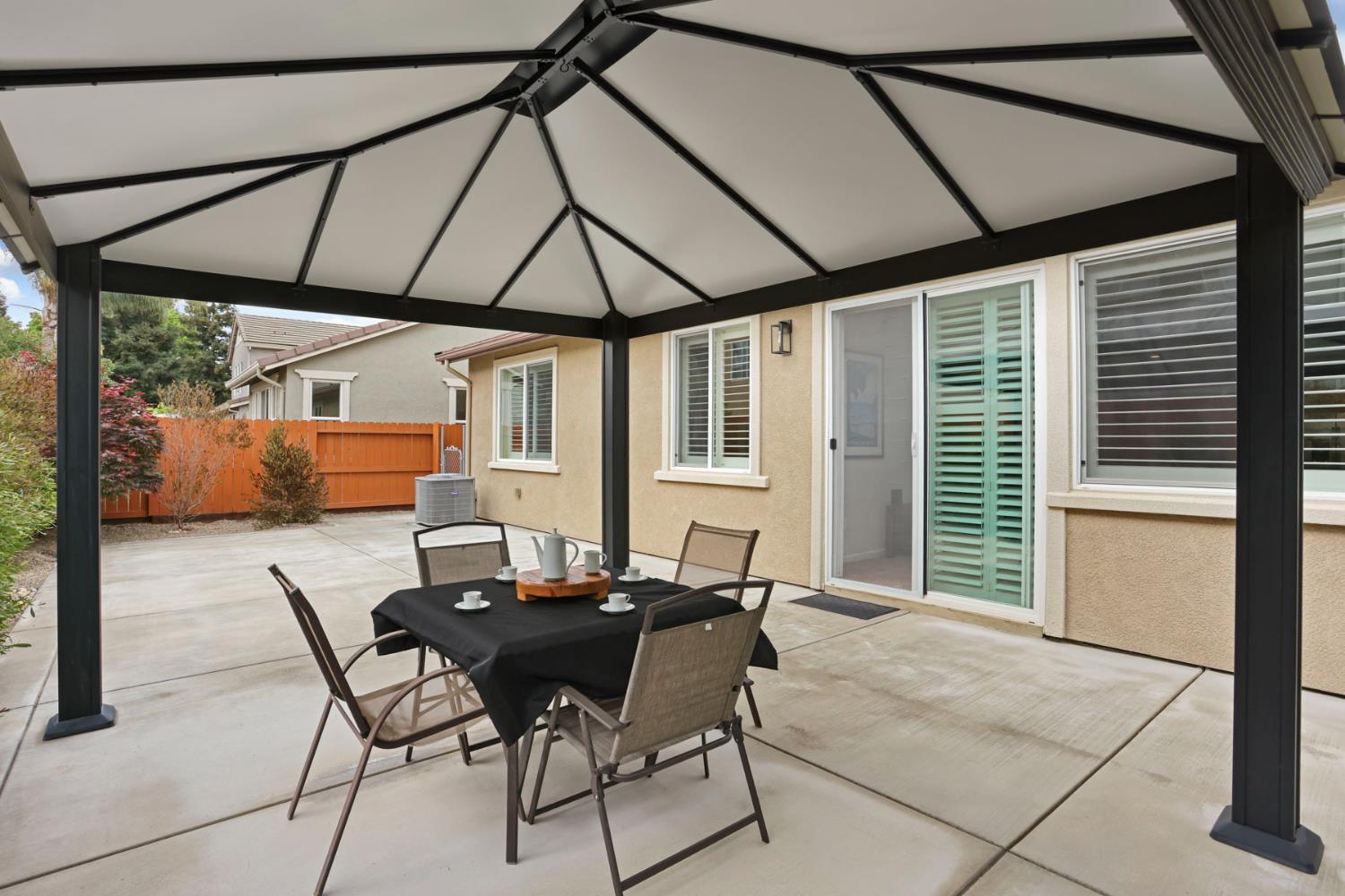 3828 Lookout Drive Modesto, CA 95355 - Photo 23 of 39 a dining room with glass windows and table