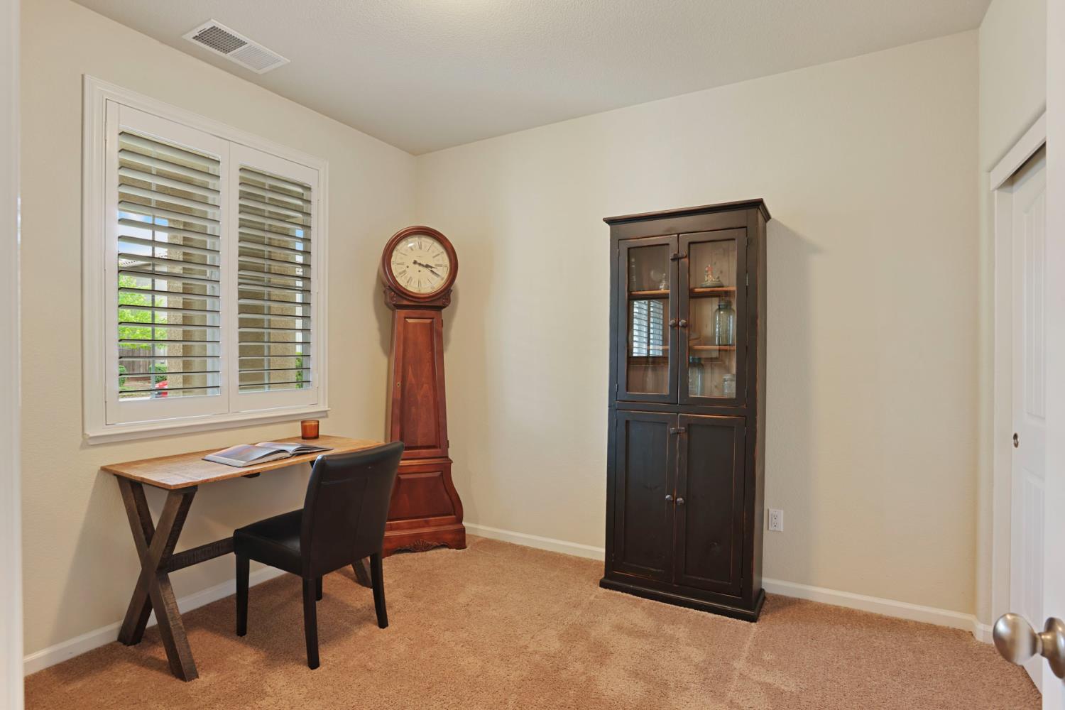 3828 Lookout Drive Modesto, CA 95355 - Photo 5 of 39 a room with a table and a chair