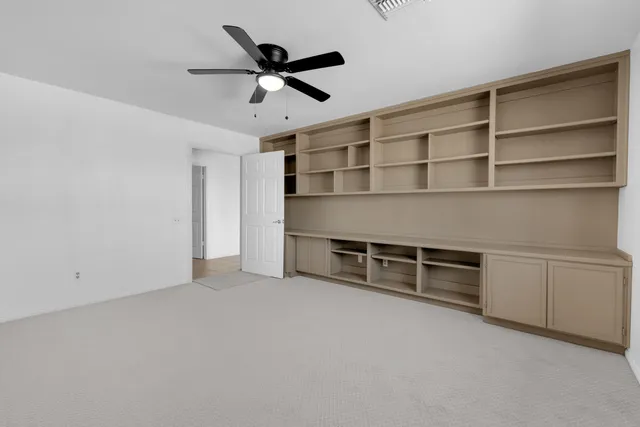 an empty room with windows and natural light