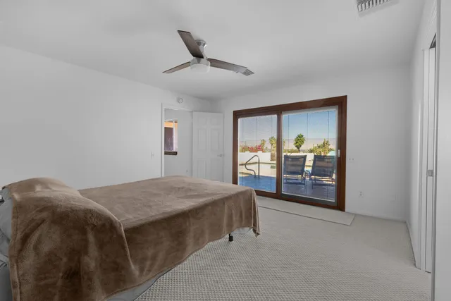 a large kitchen with stainless steel appliances a stove a sink dishwasher and a refrigerator