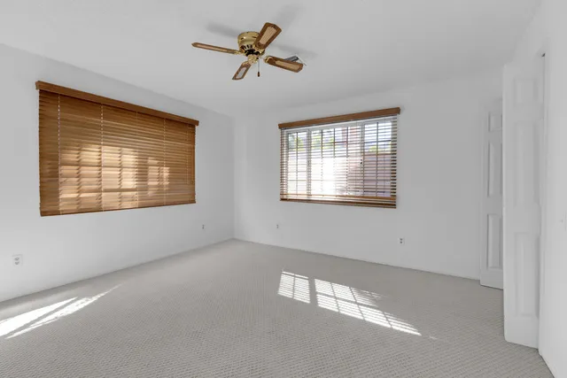 a view of a kitchen with refrigerator and a kitchen
