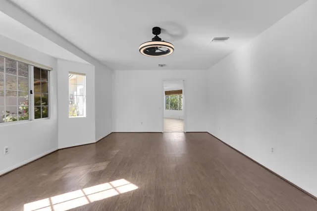 a view of a patio with table and chairs and potted plants