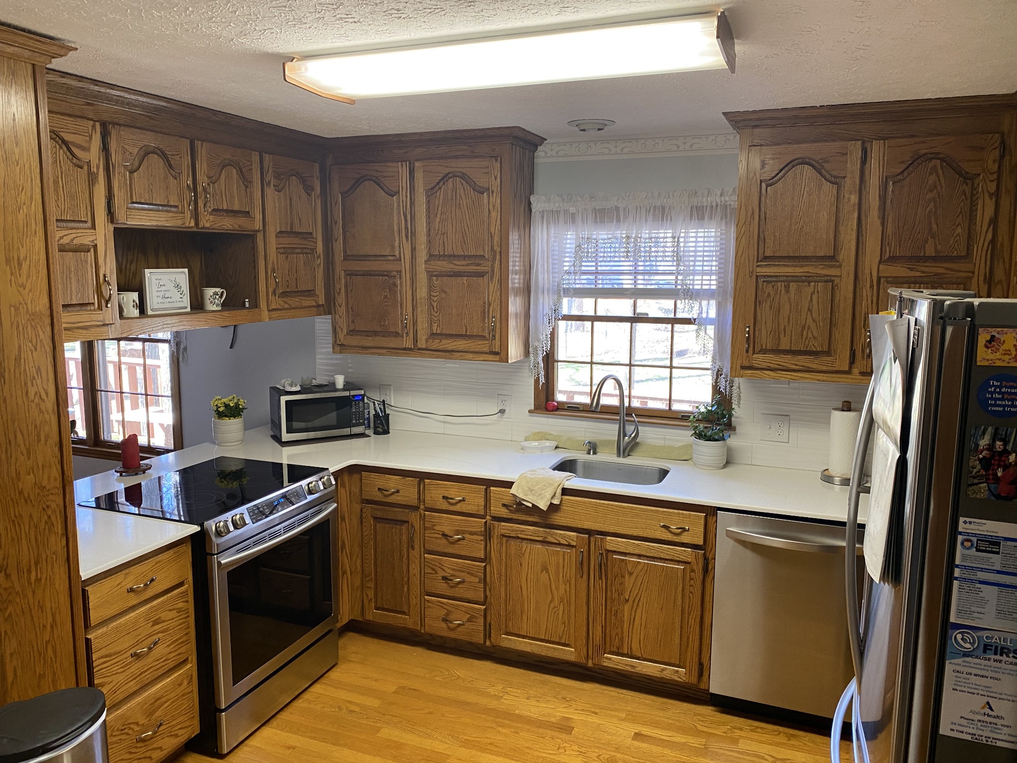 4583 Mt View Road Manchester, TN 37355 - Photo 9 of 18 a kitchen with stainless steel appliances granite countertop a sink stove and refrigerator