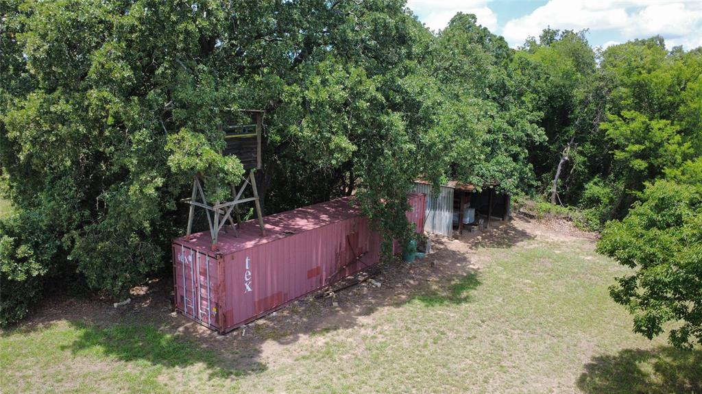 3175 Clater Powell Road Waco, TX 76705 - Photo 8 of 19 a view of a backyard with plants and trees