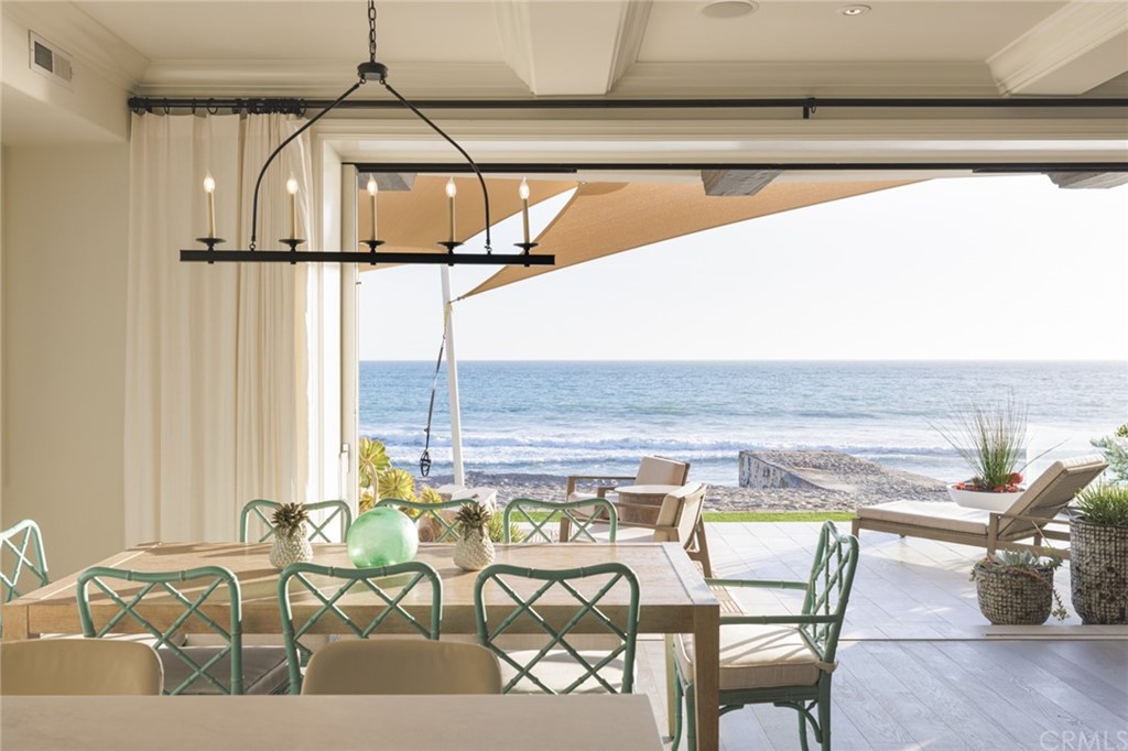 35271 Beach Road Dana Point, CA 92624 - Photo 20 of 61 a view of a swimming pool with a lounge chair