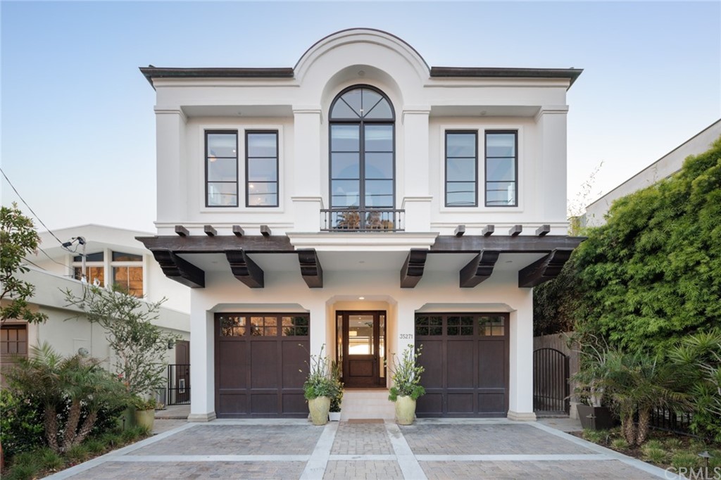 35271 Beach Road Dana Point, CA 92624 - Photo 2 of 61 a front view of a house with a garden