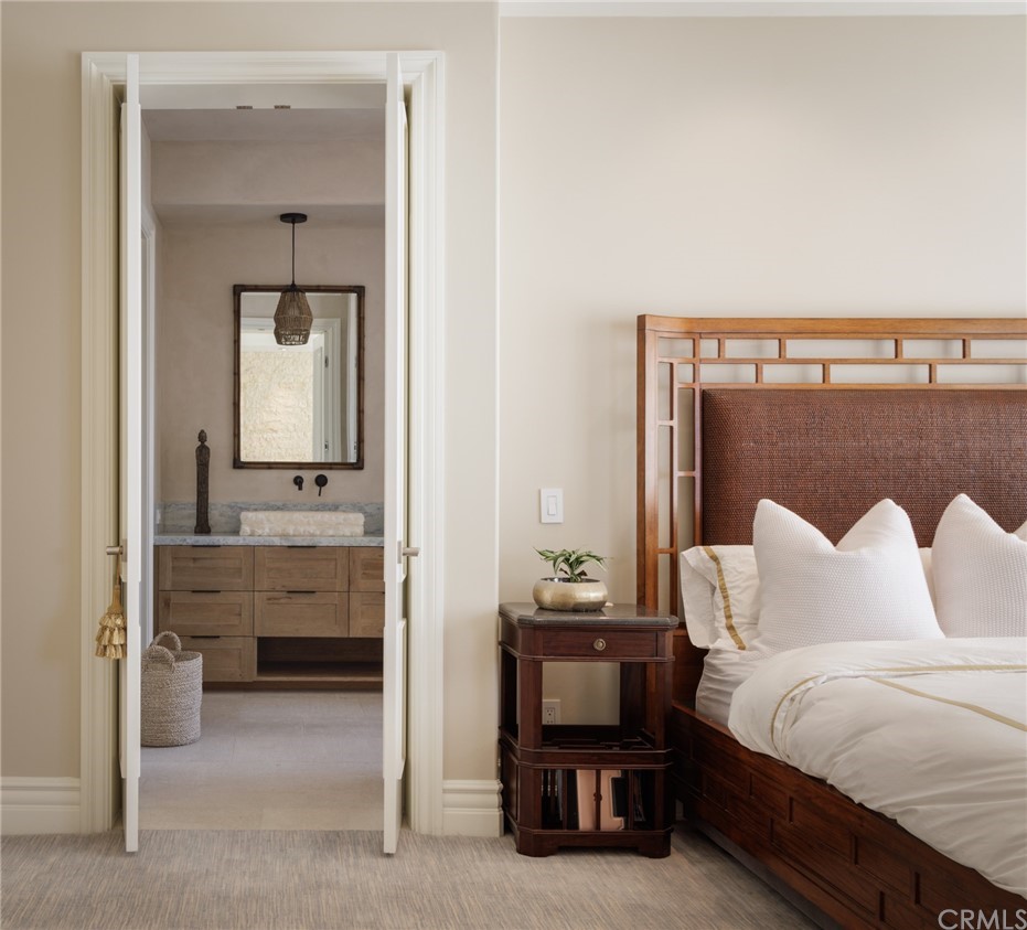 35271 Beach Road Dana Point, CA 92624 - Photo 26 of 61 a bedroom with furniture and a mirror