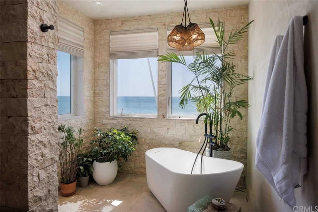 35271 Beach Road Dana Point, CA 92624 - Photo 29 of 61 a white bath tub sitting in a bathroom next to a white tub