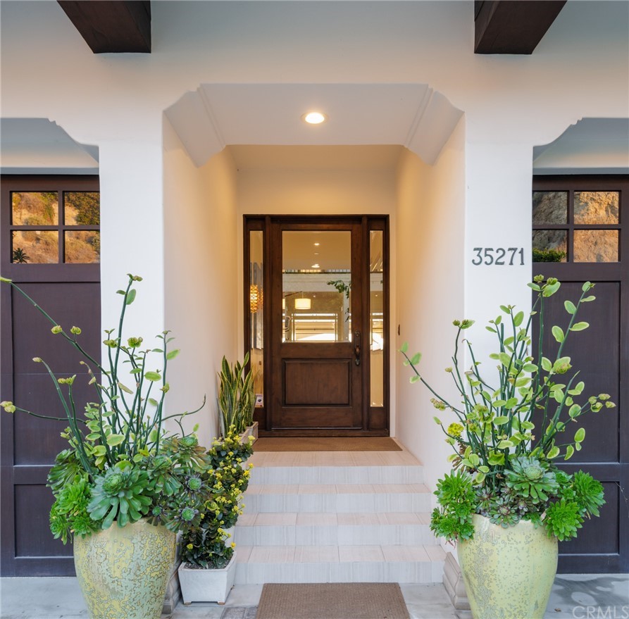 35271 Beach Road Dana Point, CA 92624 - Photo 3 of 61 a front view of a house with a potted plant