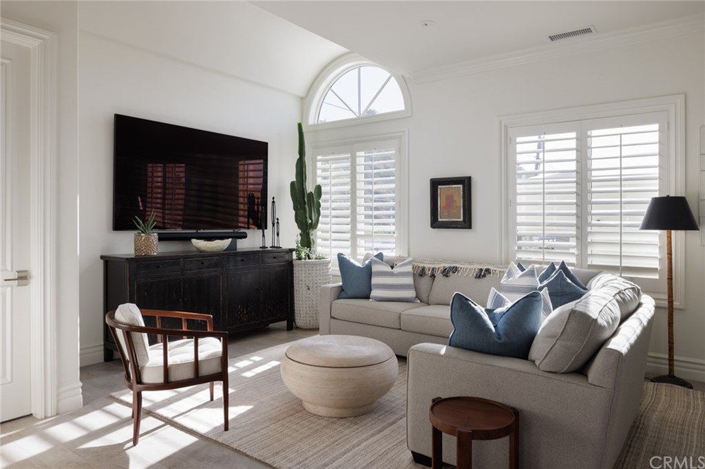 35271 Beach Road Dana Point, CA 92624 - Photo 32 of 61 a living room with furniture and a flat screen tv