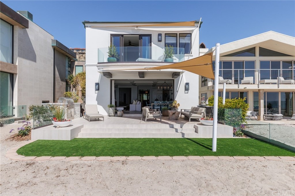35271 Beach Road Dana Point, CA 92624 - Photo 41 of 61 a view of a building with a patio and a yard