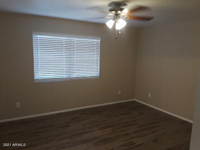 4957 Casper Road Mesa, AZ 85205 - Photo 20 of 24 a view of a room that has a window and wooden floor