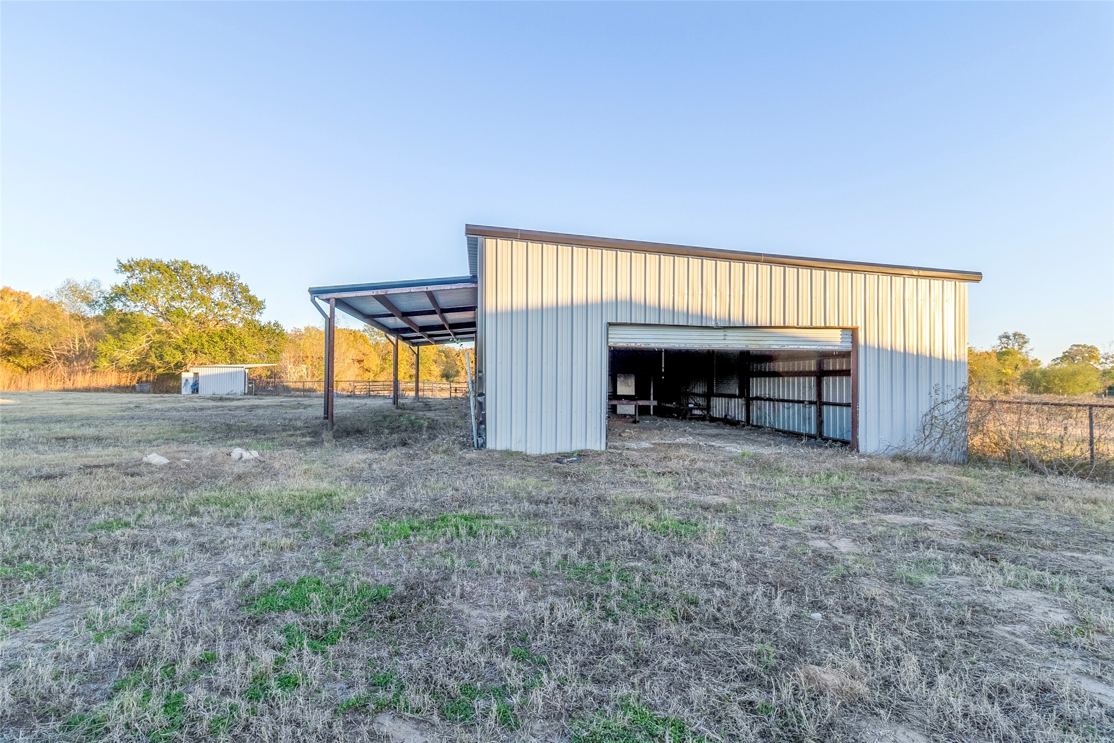 9477 County Road 420 Navasota, TX 77868 - Photo 13 of 25 a view of an house with backyard and furniture
