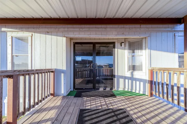 a porch with wooden floor