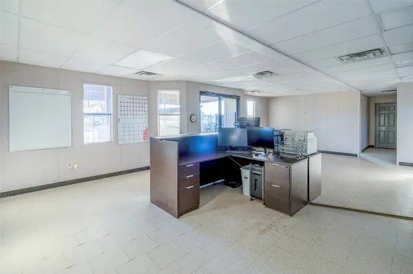 a workspace with furniture and window