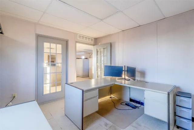 a view of a livingroom and a kitchen