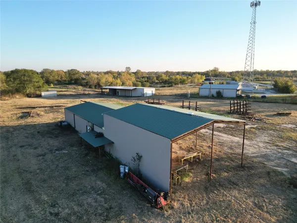 a view of a terrace with lawn chairs